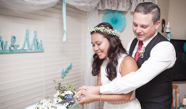 Filipina bride cutting cake